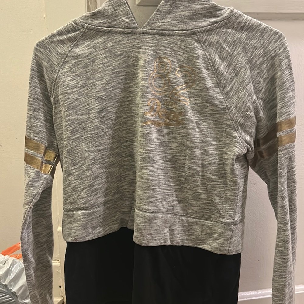 The tang top is attached but the hoodie very comfy and will keep you warm.